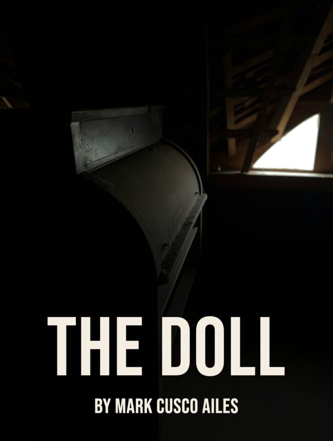A dark attic with an old desk and a small skylight, with the title The Doll by Mark Cusco Ailes